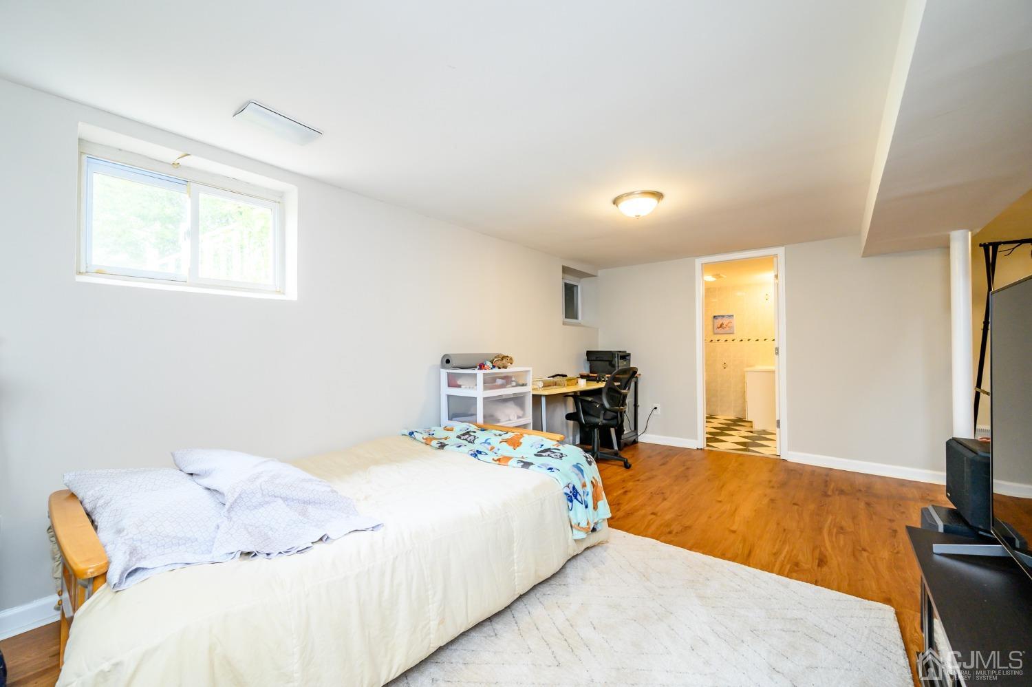 10 Ferris Road Edison, NJ 08817 - Photo 23 of 32 a bed room with a bed and a television