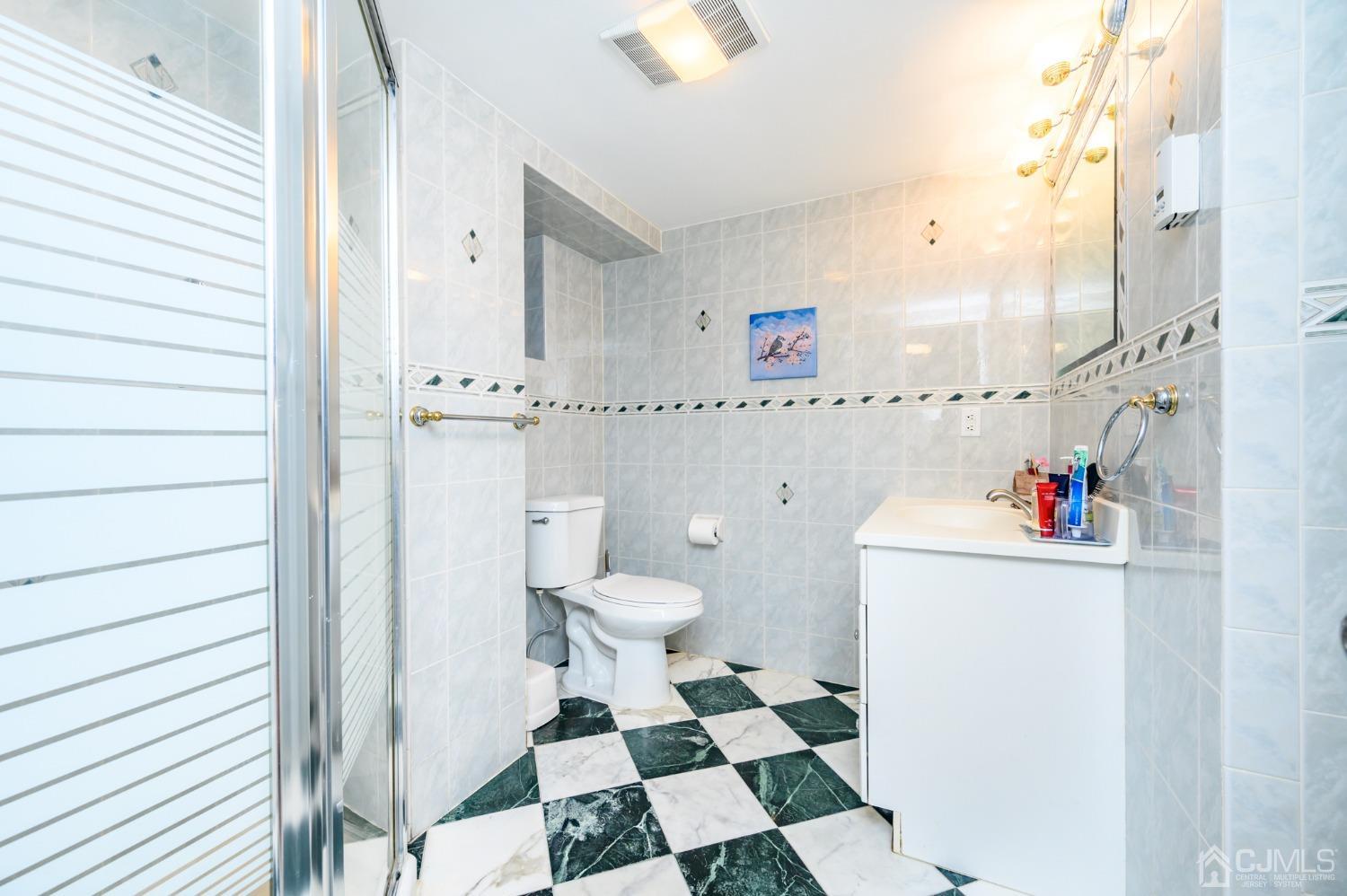 10 Ferris Road Edison, NJ 08817 - Photo 27 of 32 a bathroom with a sink toilet and shower