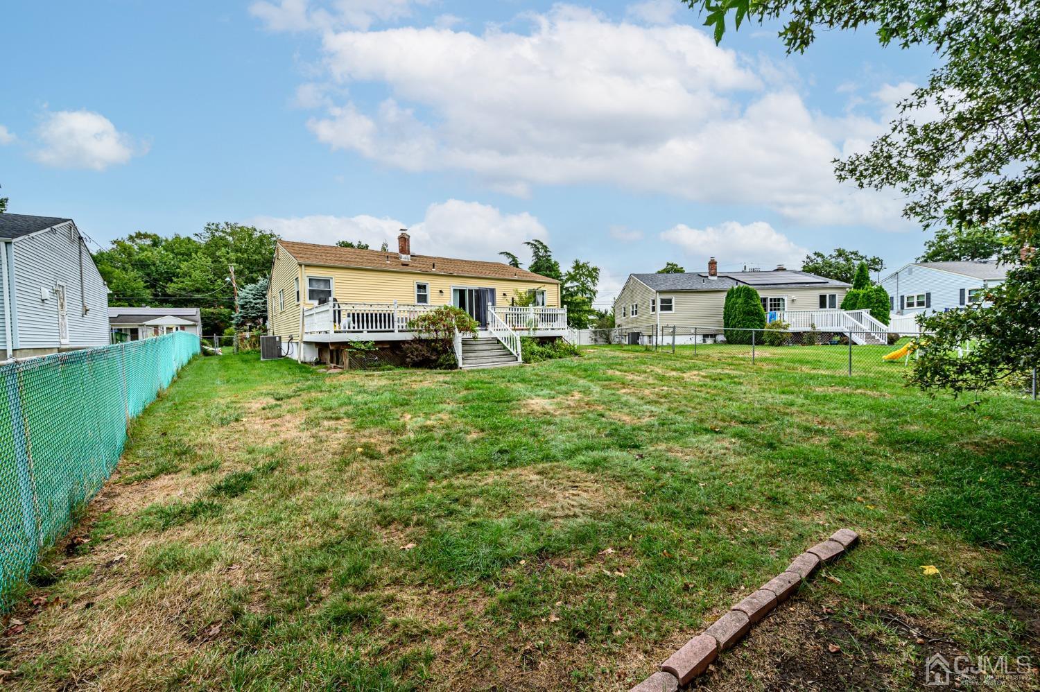 10 Ferris Road Edison, NJ 08817 - Photo 31 of 32 an outdoor view of a house with a yard
