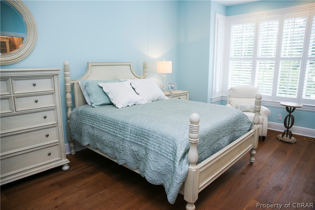 1000 Queenstown Road Lancaster, VA 22503 - Photo 46 of 49 a bedroom with a bed and a dresser