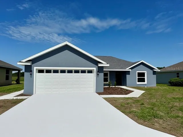 a front view of a house with yard