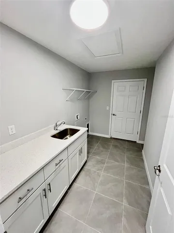 a kitchen with a sink and cabinets