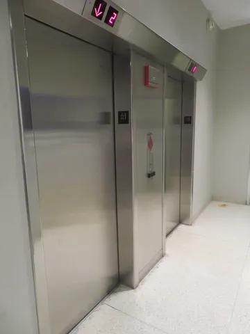 a bathroom with a shower and a rack