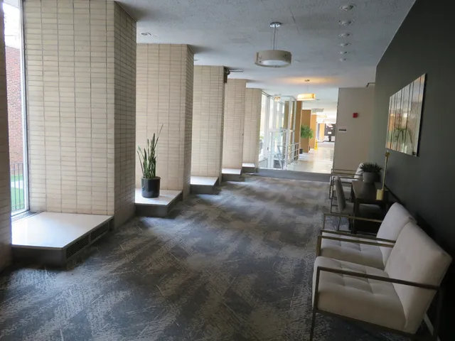 a view of hall way with furniture