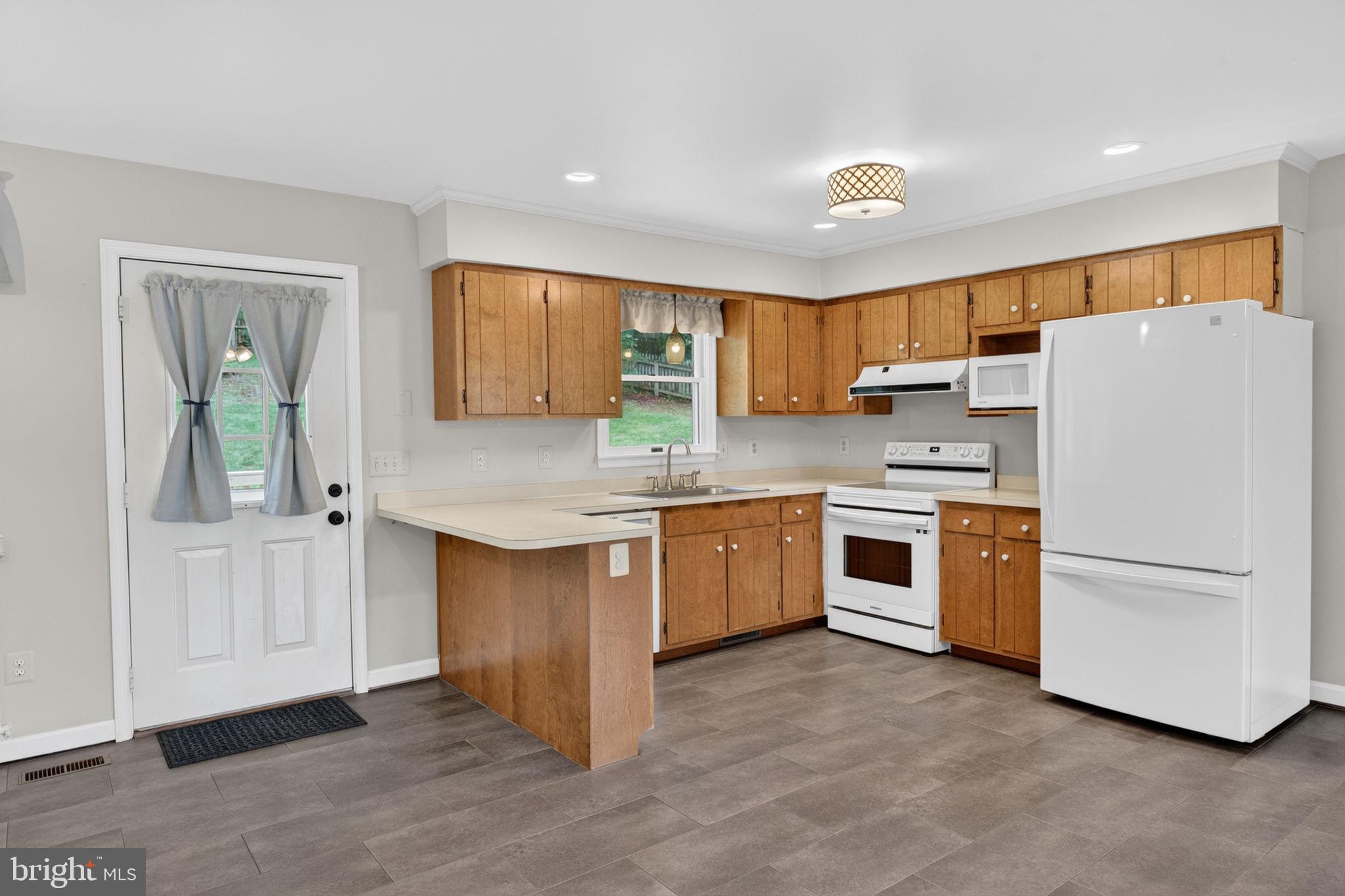1001 Wiseburg Road White Hall, MD 21161 - Photo 11 of 46 Practical kitchen layout with space for a table.