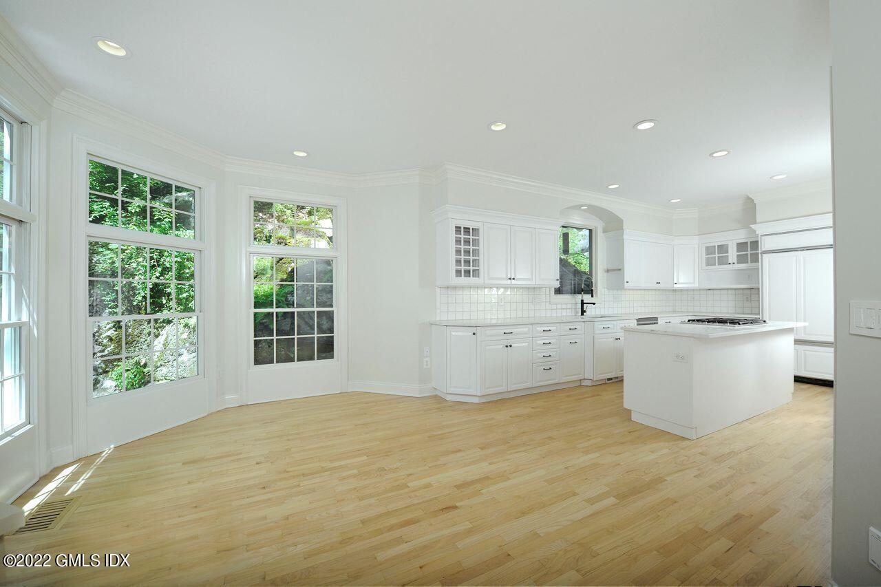 15 Horseshoe Road Cos Cob, CT 06807 - Photo 12 of 33 a large white kitchen with a large window