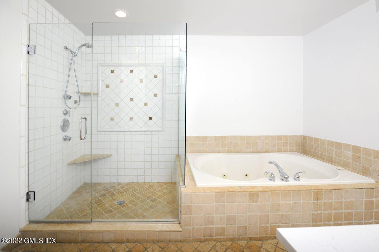 15 Horseshoe Road Cos Cob, CT 06807 - Photo 16 of 33 a bathroom with a bathtub and shower