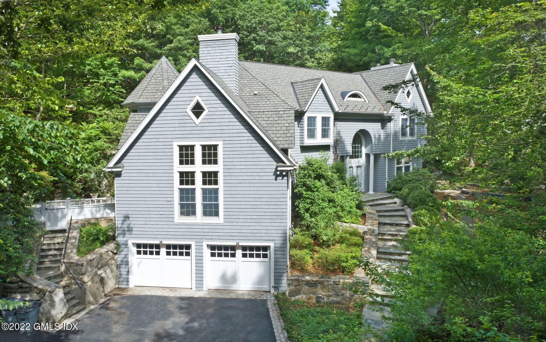 15 Horseshoe Road Cos Cob, CT 06807 - Photo 2 of 33 a view of a house with brick walls and trees
