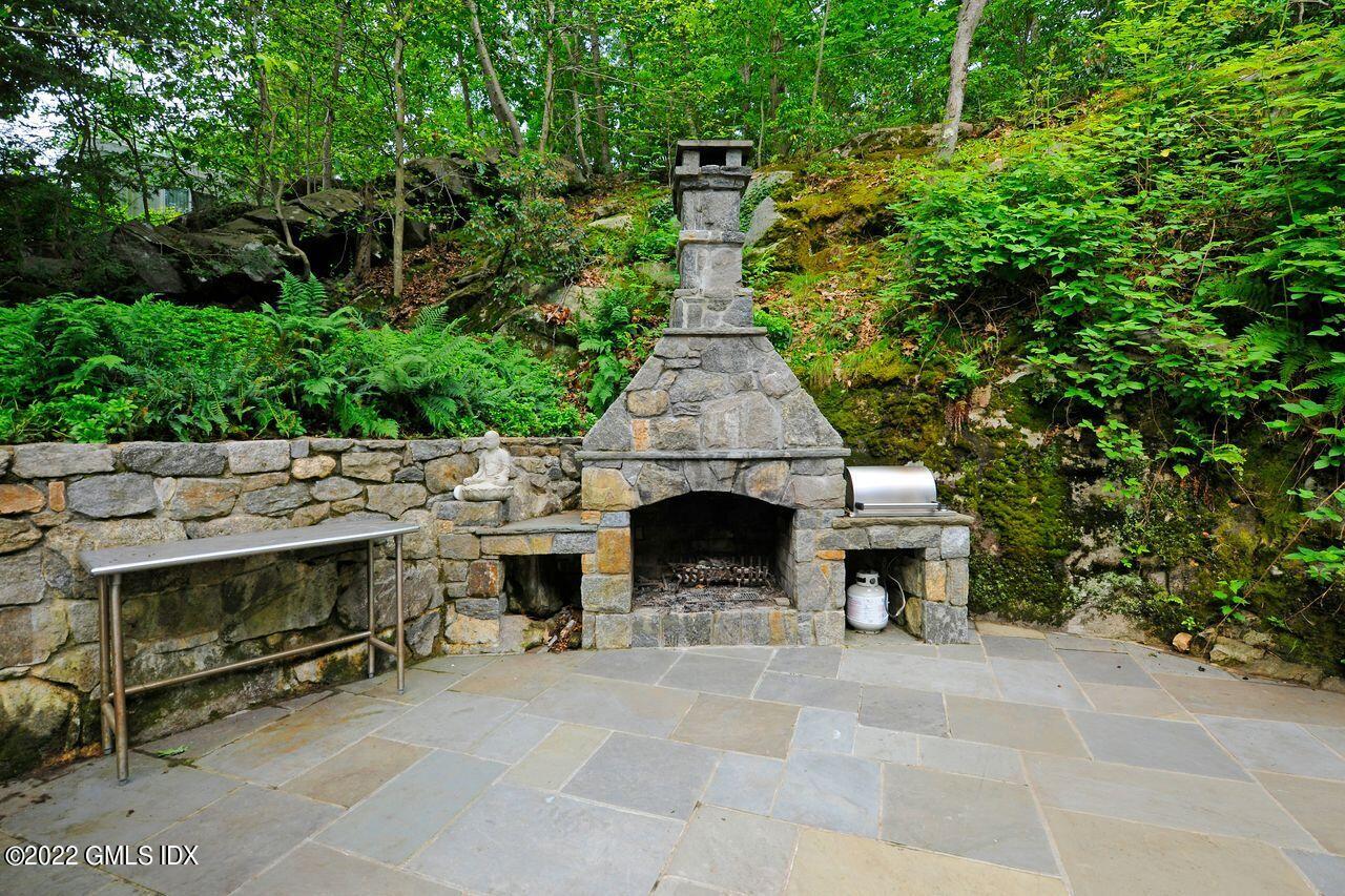 15 Horseshoe Road Cos Cob, CT 06807 - Photo 21 of 33 a view of house with yard outdoor seating and green space