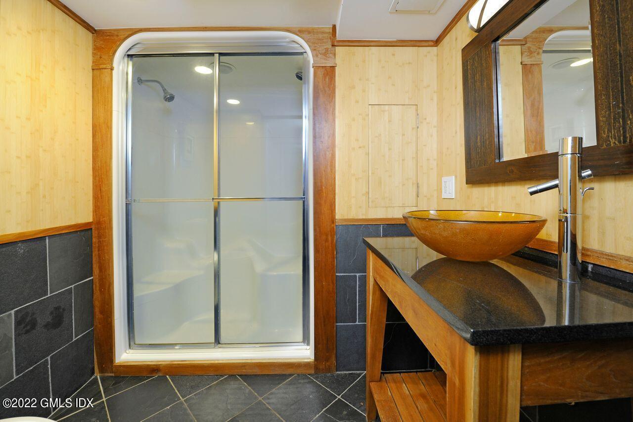 15 Horseshoe Road Cos Cob, CT 06807 - Photo 24 of 33 a bathroom with a sink and a mirror