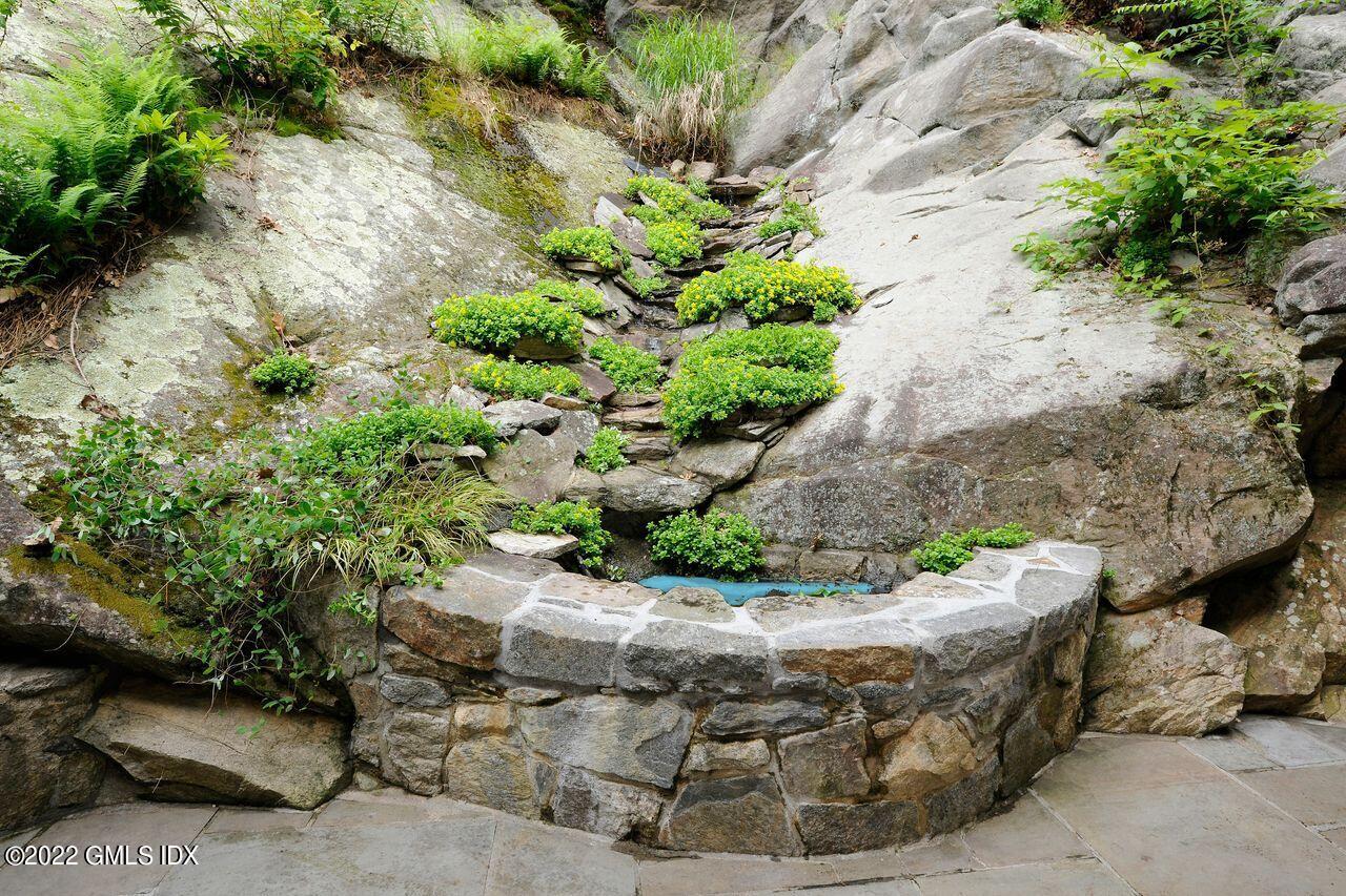 15 Horseshoe Road Cos Cob, CT 06807 - Photo 26 of 33 a view of a garden with a tree