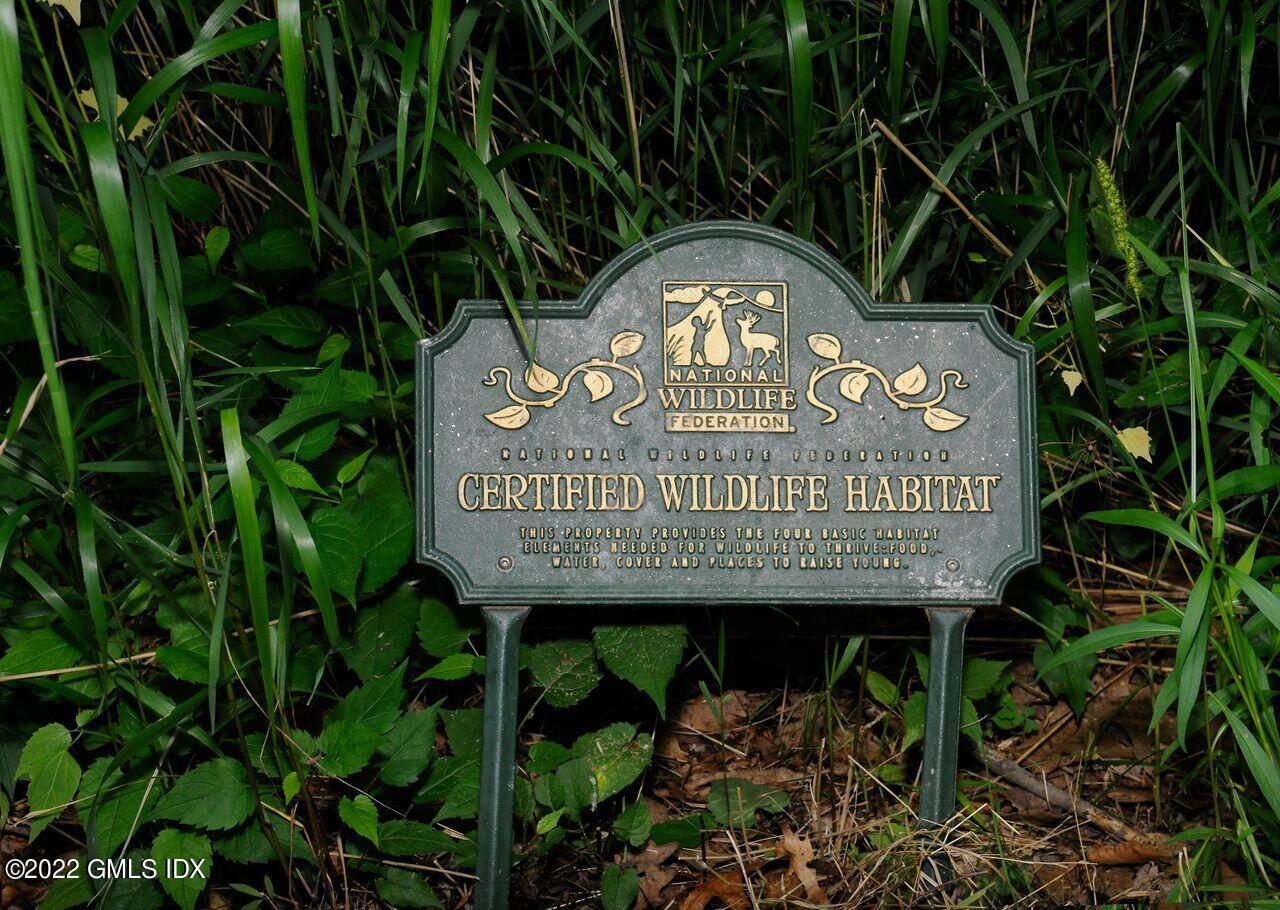 15 Horseshoe Road Cos Cob, CT 06807 - Photo 28 of 33 a sign on the side of the wall