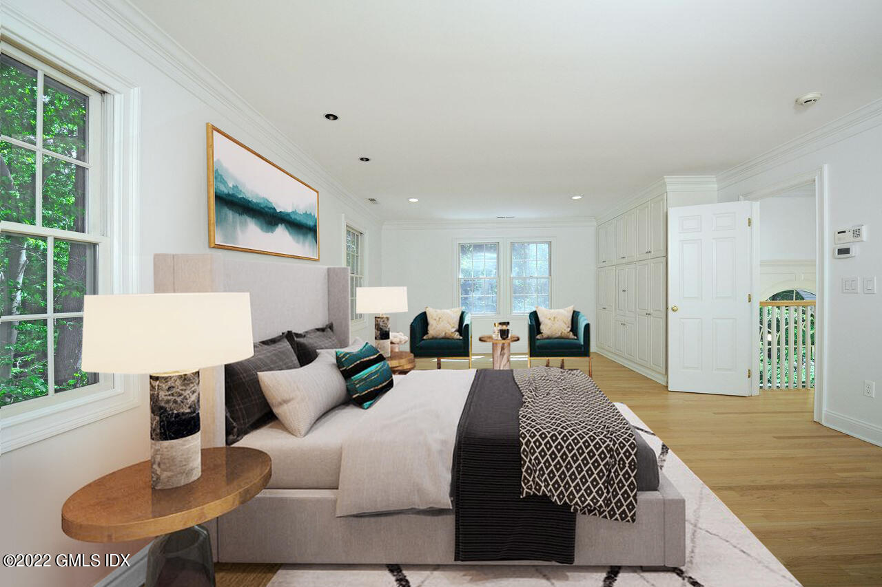 15 Horseshoe Road Cos Cob, CT 06807 - Photo 8 of 33 a large bedroom with furniture and a flat screen tv