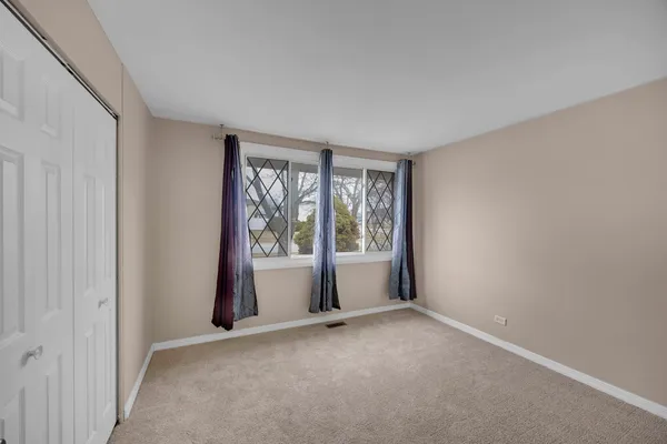 a view of livingroom with furniture and floor to ceiling window