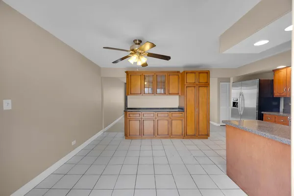 a kitchen with stainless steel appliances granite countertop a sink and cabinets