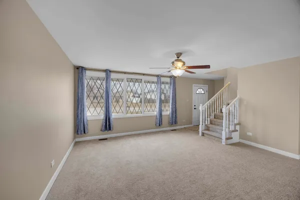 a view of a livingroom with a staircase