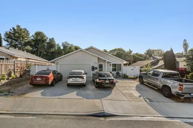 a view of a cars parked in front of a house