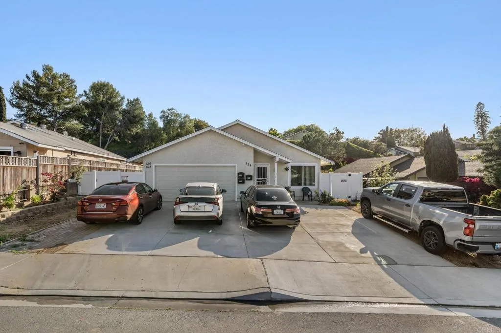 a view of a cars parked in front of a house