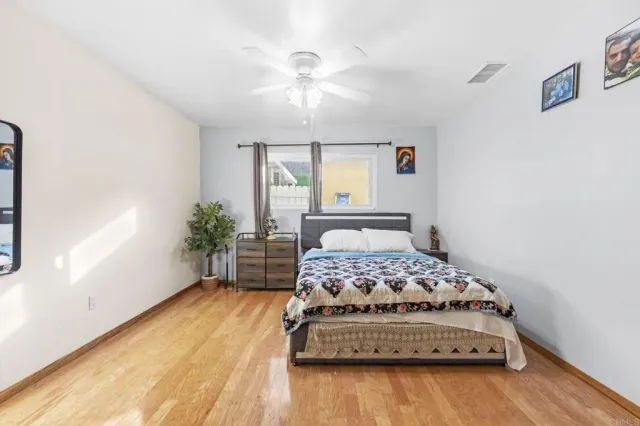 a bathroom with a shower sink vanity mirror and toilet