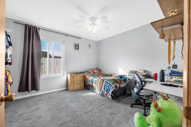 a view of a balcony with wooden floor and potted plants