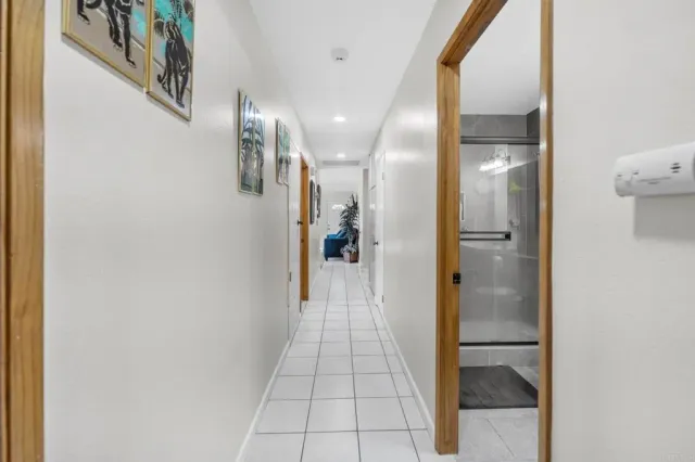 a view of a pathway of a house with a balcony