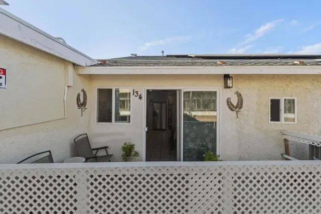 a view of a backyard with pathway