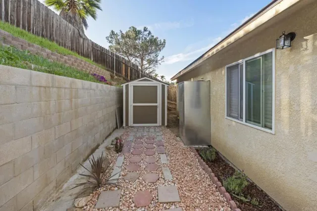 a view of a storage and utility room with washer and dryer
