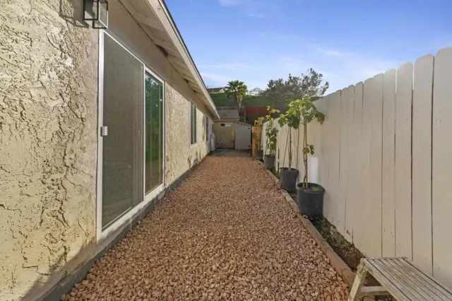 a view of a storage and utility room with washer and dryer