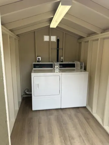 an aerial view of a house with a yard basket ball court and a fountain