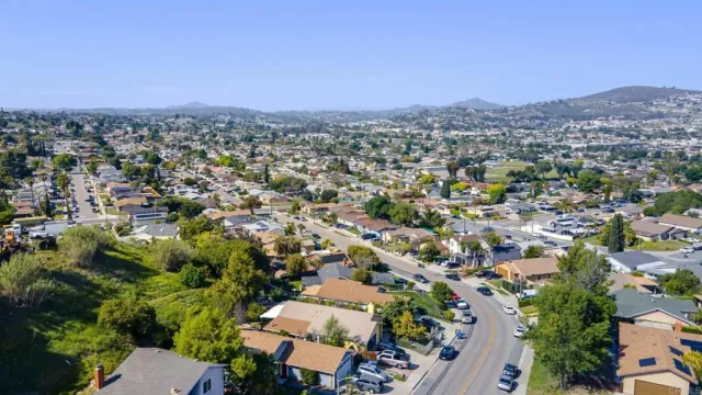 an aerial view of a house with outdoor space