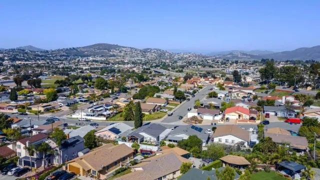 an aerial view of a houses with outdoor space