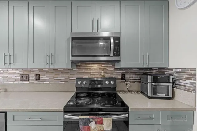 a bathroom with a sink toilet a mirror and shower
