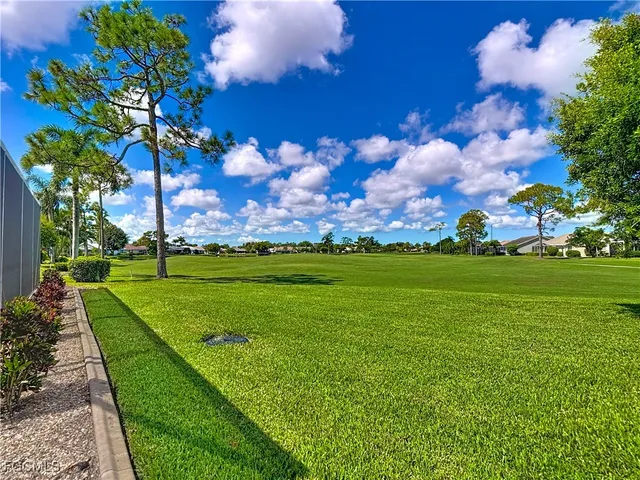 a view of a golf course with a lake