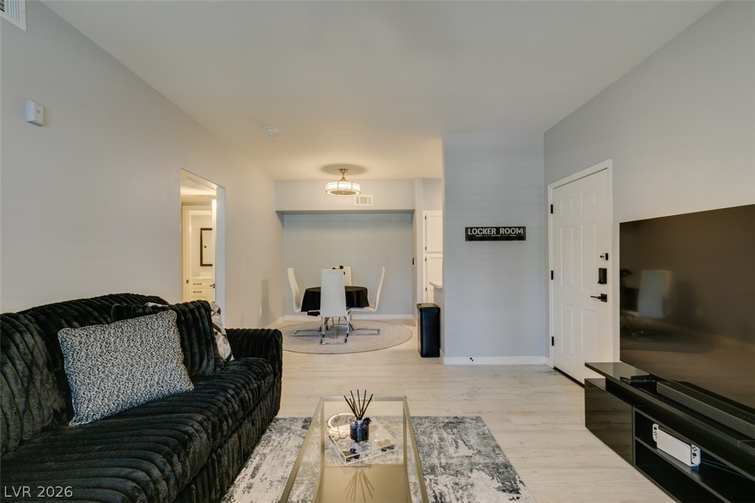 7255 West Sunset Road, Unit 1103 Las Vegas, NV 89113 - Photo 16 of 35 Clean lines and a functional layout define this comfortable living and dining area.