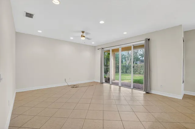 a kitchen with stainless steel appliances granite countertop a stove refrigerator sink and cabinets