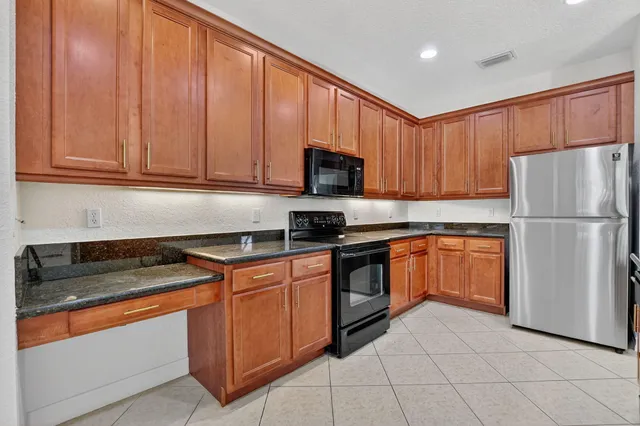 a view of a hallway with wooden floor and stairs