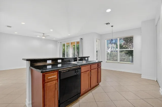 a view of a hallway with wooden floor and stairs