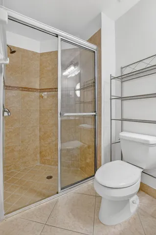 a bathroom with a tub a sink and a large mirror