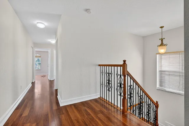 a spacious bathroom with a sink mirror and a bathtub