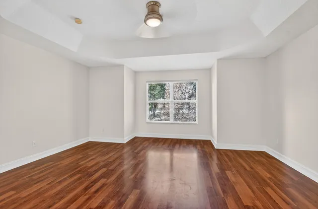 a bathroom with a double vanity sink a toilet and a shower