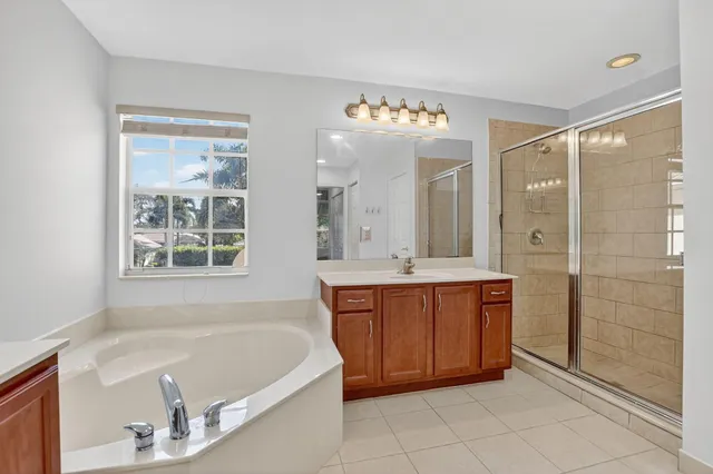 a bathroom with a sink a mirror and a bathtub