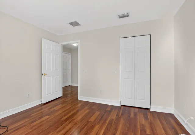 a view of a backyard with plants and a garden