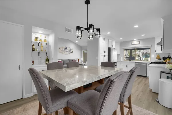 a dining room with furniture and window