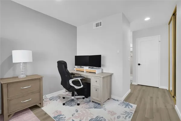 a view of a workspace with furniture