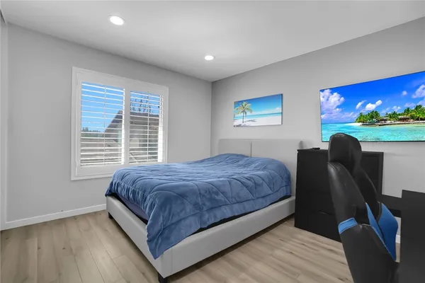 a bedroom with two beds and painted walls