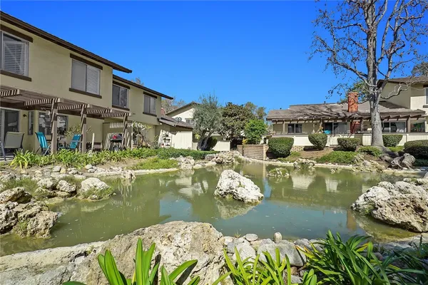 a swimming pool with outdoor seating and yard