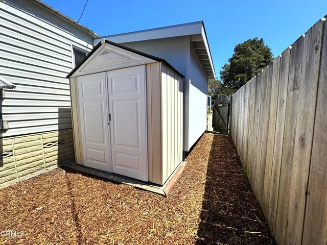 a view of a field with a mountain in the background