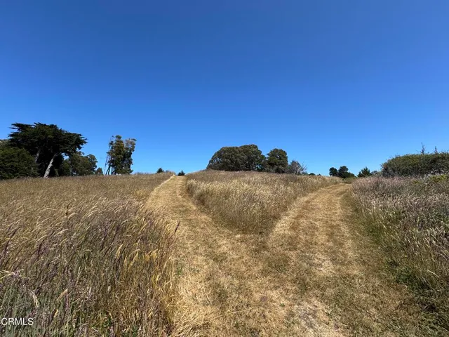a view of lake with mountain in background
