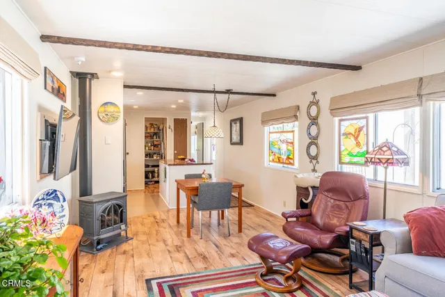 a kitchen that has a lot of cabinets a sink and appliances in it