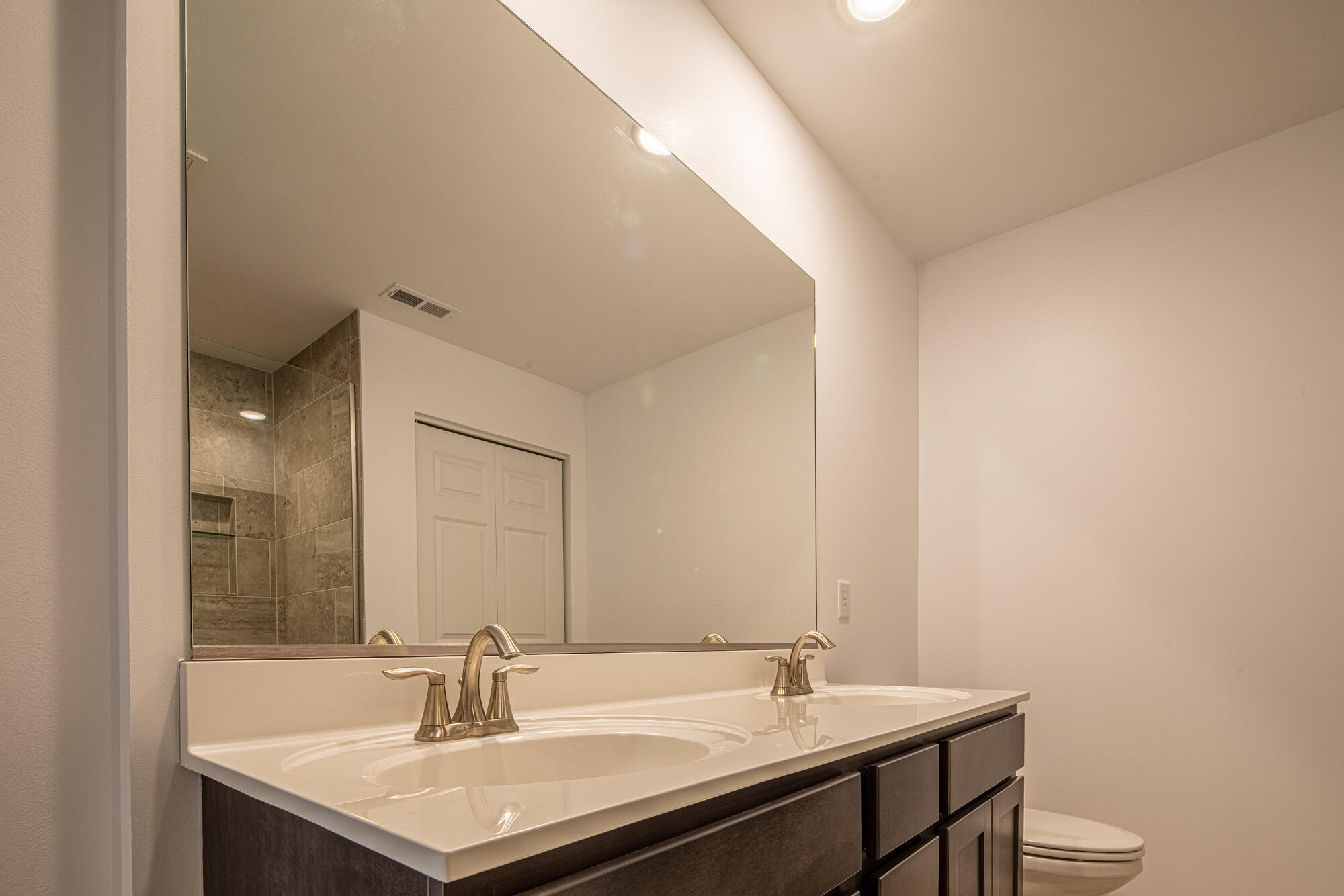13131 Rutledge Place Crown Point, IN 46307 - Photo 17 of 25 a bathroom with a sink and a toilet